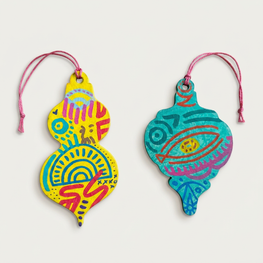 Yellow and aqua ornaments with an almost-white background
